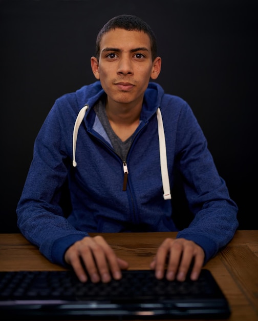Student portrait and man typing on keyboard programming on assignment for university on illegal website Studying computer science and development in home hacking and technology pov for coding