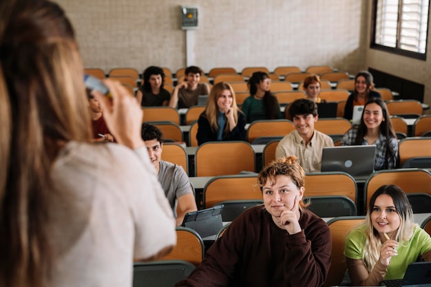 Students paying attention in class with teacher