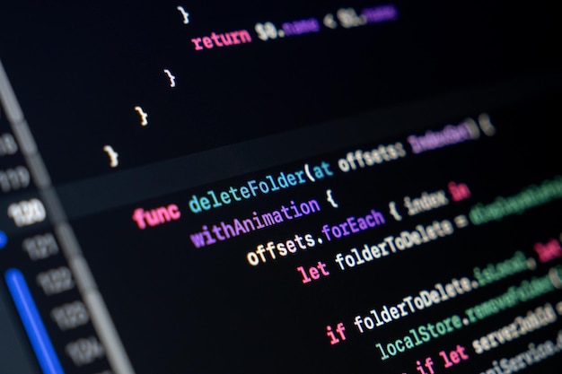 Swift function code on screen showing folder deletion logic with animation and loop structure