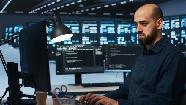System administrator working in computer network security data center