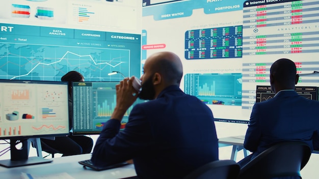 Team of diverse business consultants study feedback on old projects