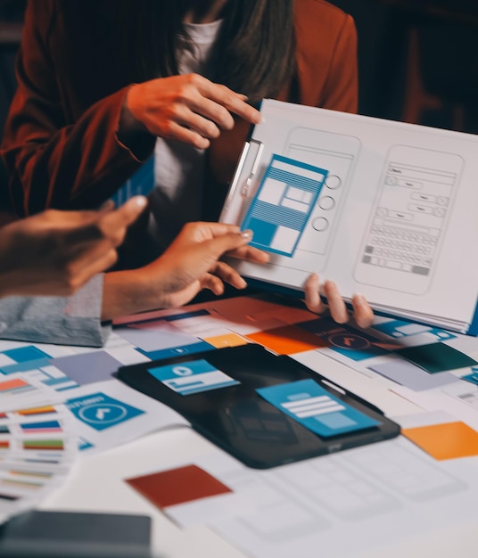 team of UI UX web designer are working together to develop mobile responsive websites Mobile Mockup