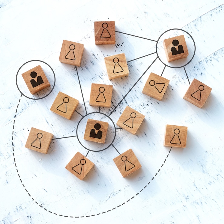 Bild teamwork and communication concept, rectangular wooden blocks on a white wooden table.