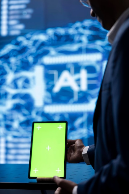 technician in startup doing advancements in ai field using chroma key tablet