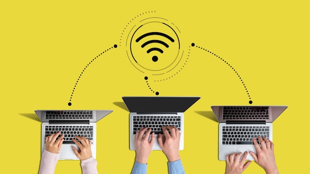 the concept of connected employees with company laptops to the wi-fi network.