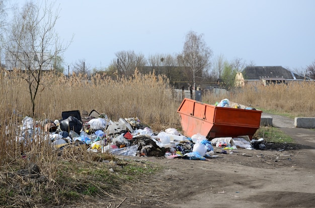 The garbage can is packed with garbage and waste. Untimely removal of garbage in populated areas