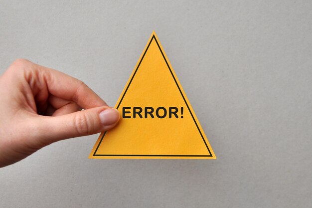 The image of the yellow triangle and the inscription error on it
