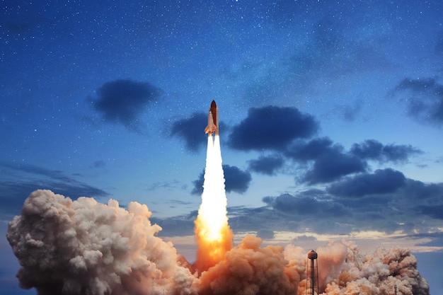 the new space shuttle takes off into the evening sky with stars successful launch of a space rocket into space