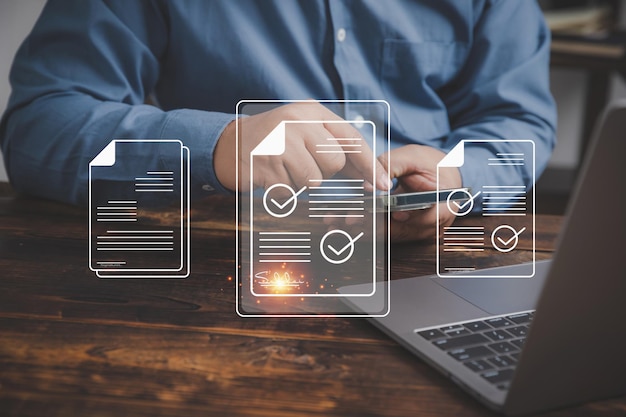 the technology of signings electronic documents in the future ideas are paperless in the office businessman use smartphones to sign an electronic signature approved on an electronic document