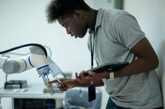 Trainee Robotics engineer learning with Programming and Manipulating Robot Hand