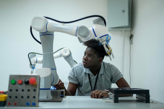 Trainee Robotics engineer learning with Programming and Manipulating Robot Hand