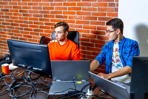 Two programmers working on new project Developing programming and coding technologies