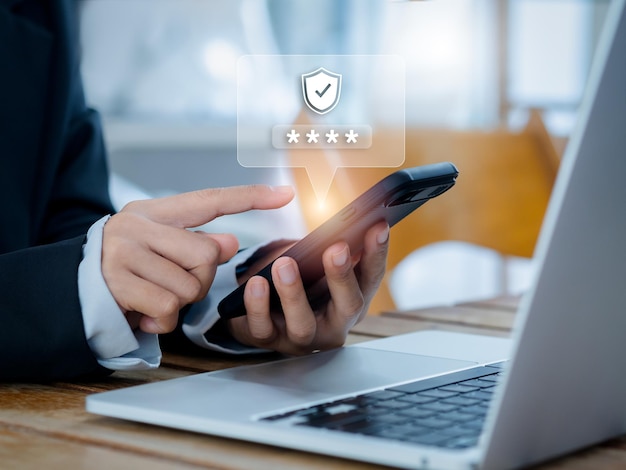 Two steps authentication 2FA concept 2023 Shield and asterisk icons code showing on smart phone while using computer for validate password Identity verification cyber security technology
