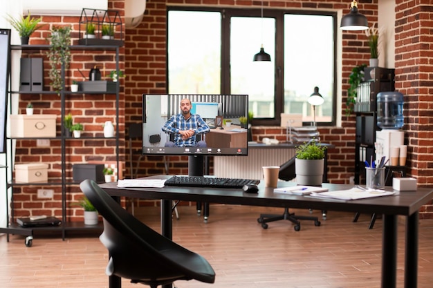 Vacant workplace with ongoing videocall