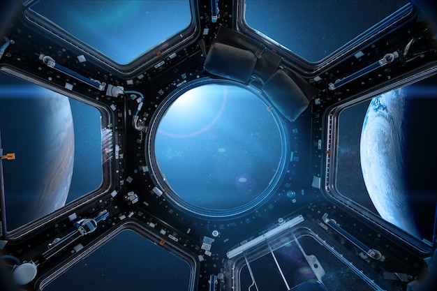 View from a porthole of space station on the Earth Elements of this image furnished by NASA