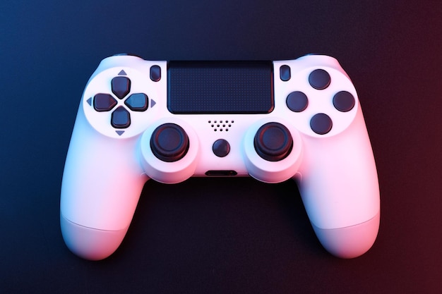 white video game controller joystick for game console isolated on black background gamer control device closeup