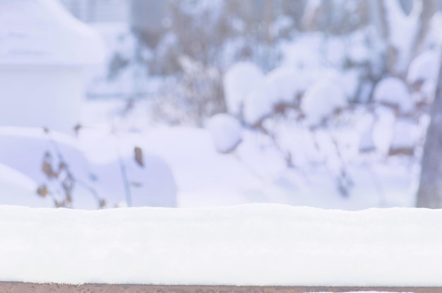 Winter garden landscape with snowdrifts Winter abstract blurred background Winter garden background with snowdrifts