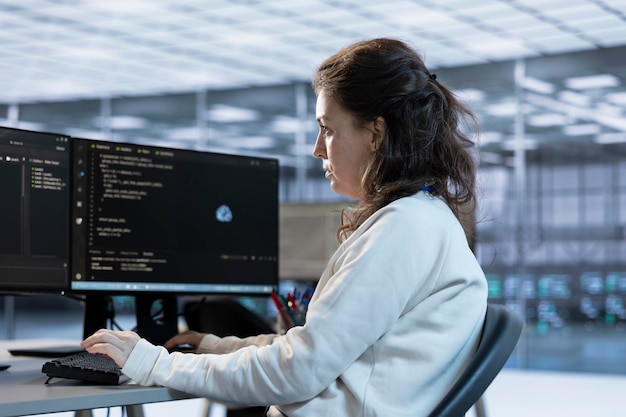 Woman in office tasked with monitoring data center supercomputers