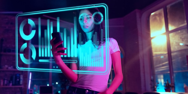 Woman using interface modern technology and digital layer effect as business, finance, economics
