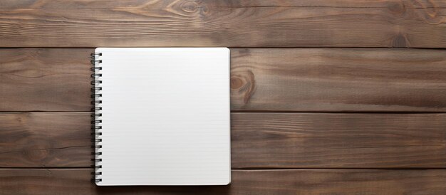 wooden table with pen and notebook displayed on it with a background image