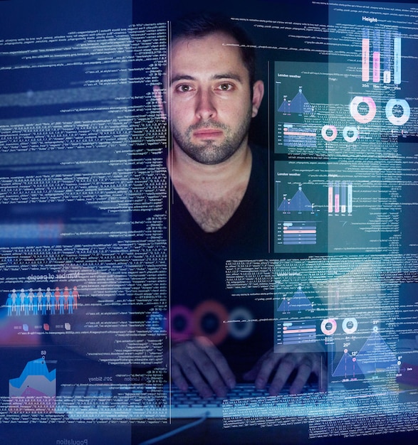 Working on new code. Cropped shot of a young computer programmer looking through data.