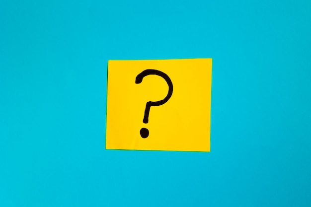 yellow paper with question mark on blue background