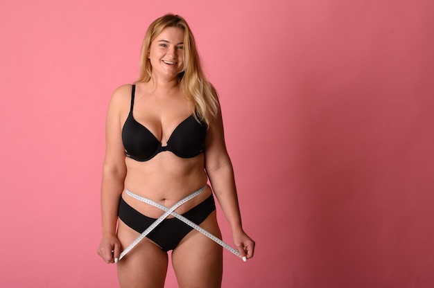 Young beautiful girl measures your body parts of roulette