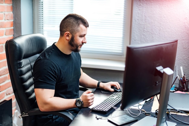 Young creative designer working on startup business in his office