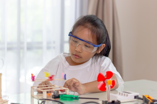 Young girl Learning robotics basics