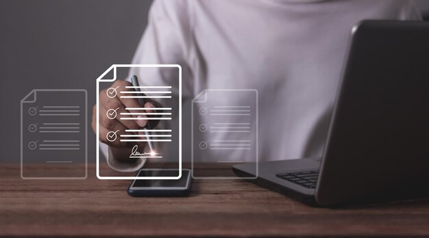 Young man with smartphone mobile hand hold a pen touching to sign a online business contract