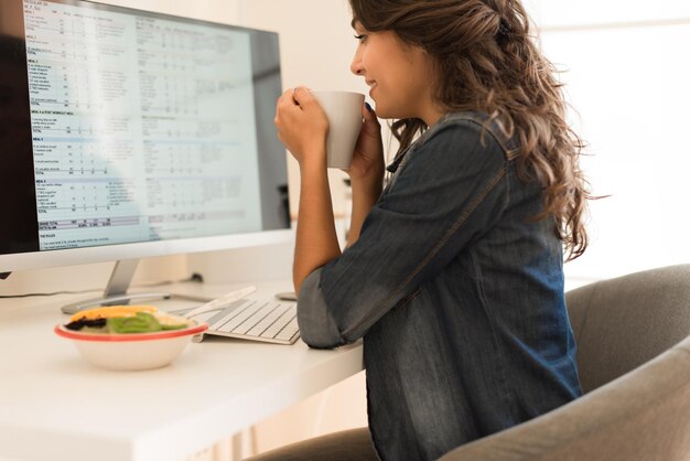 Young woman doing plans for her weekly diet