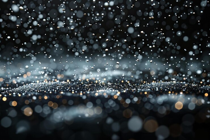 A black background with small white snowflakes falling