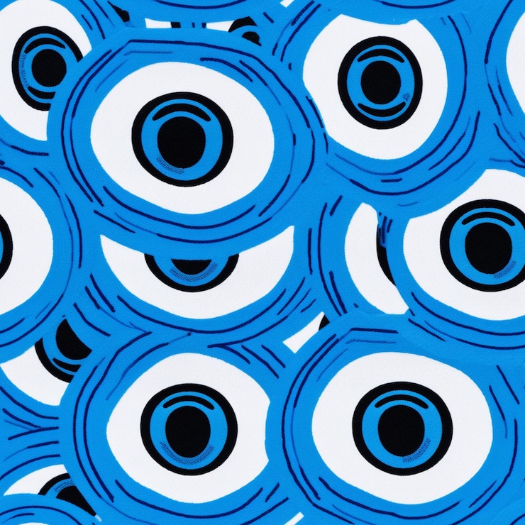 Fotoğraf a close up of a blue and white pattern with black circles generative ai