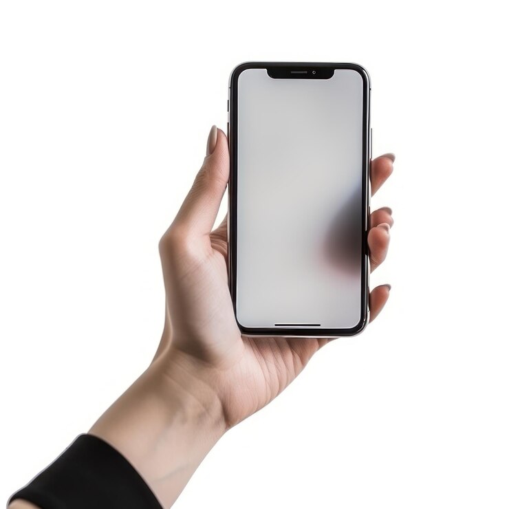 A hand holding a phone with a white background
