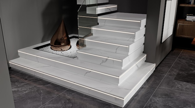 a white marble staircase with a silver base and a black wall behind it