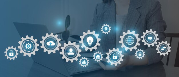 A woman is working with gears and icons of business people