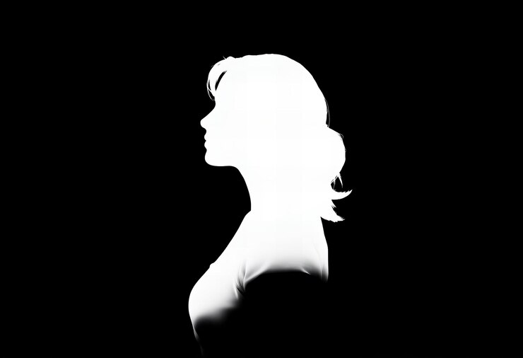 a woman with long hair and a white head is shown in a dark photo