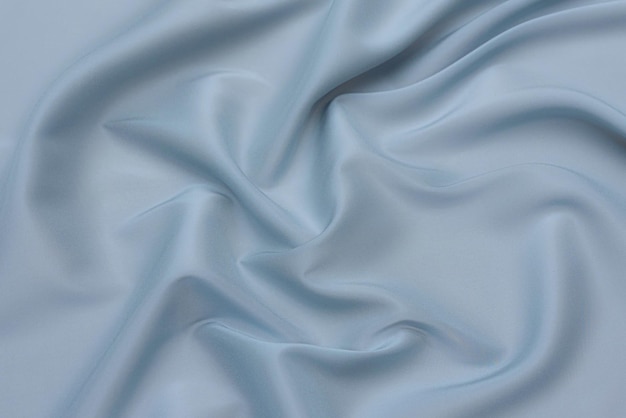 Abstract background texture of natural blue color fabric Fabric texture of natural cotton or linen silk or satin wool or jersey textile material Luxurious blue canvas background