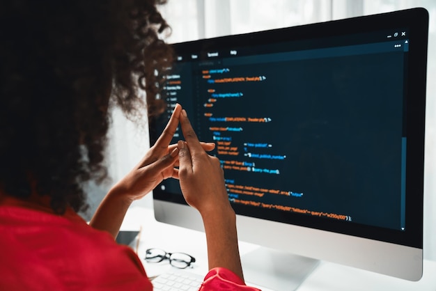 african american woman's programing developer coding software project on computer screen server at home office concept of website designer in coder network information at work space tastemaker