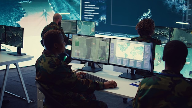 Army officer establishing new operating bases through a world map satellite