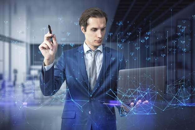 Attractive young european businessman using laptop and abstract polygonal lines hologram on blurry office interior background Big data index technology metaverse and future concept Double exposure