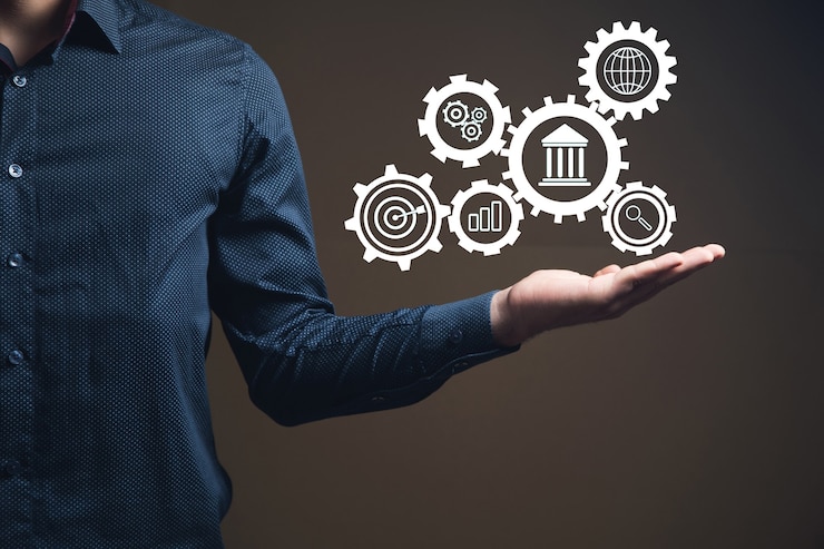 Fotoğraf automatic business management. icons in gears. businessman holds in hand