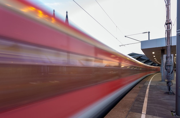 Blurred motion of train at railroad station platform