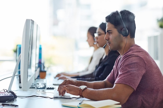 Business people call center and workspace for customer service e commerce support or virtual communication Consultant or employees typing on computer at online agency website chat and contact us