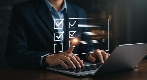 Business professional reviewing checklist on a laptop