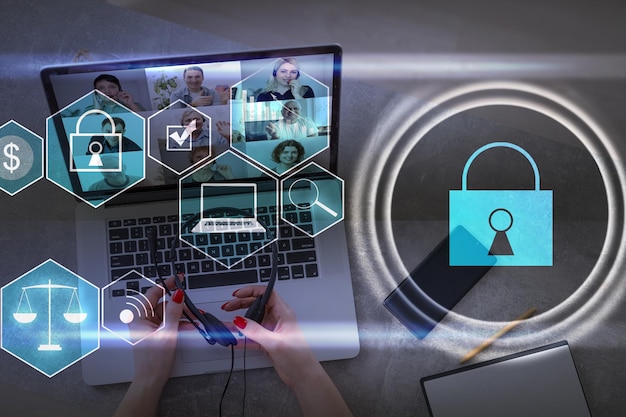 businesswoman with laptop, desktop at office interior, blue glowing information protection icons. padlock and business data symbols. concept of cyber security and data storage.