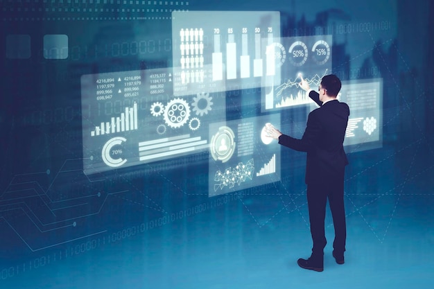 Caucasian businessman working on futuristic business charts