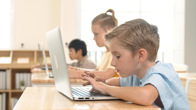 Caucasian child programing software system and learning about coding pedagogy