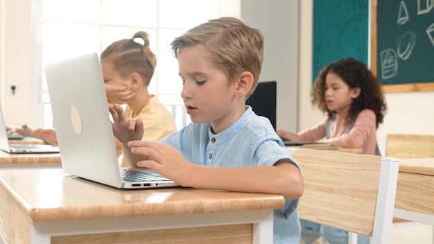 Caucasian child programing software system and learning about coding pedagogy