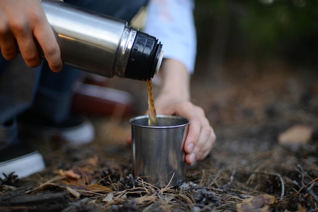 close-up of hand pouring drink
